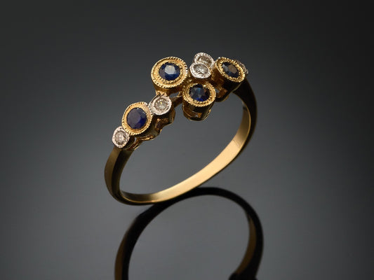 Кольцо с бриллиантами и сапфирами